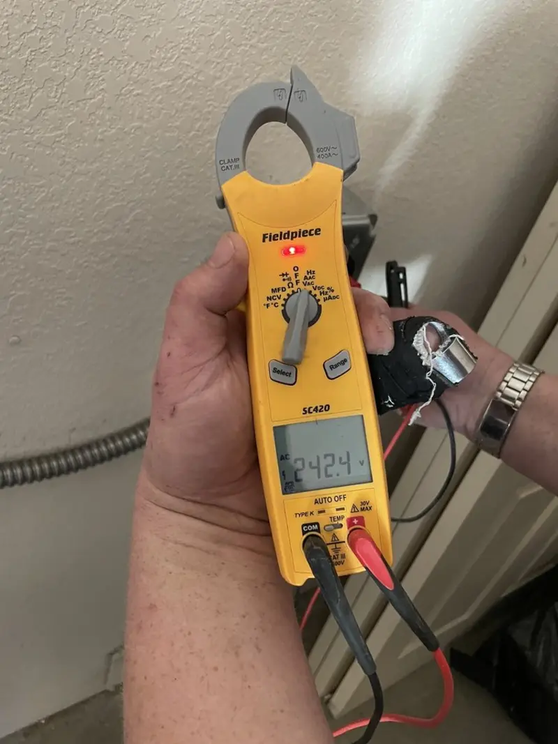 Voltage testing with clamp meter during Outlet Installation in Palatine